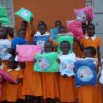 Handing out the first mosquitoes nets for children