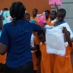 Handing out the first mosquitoes nets for children