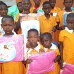 Handing out the first mosquitoes nets for children